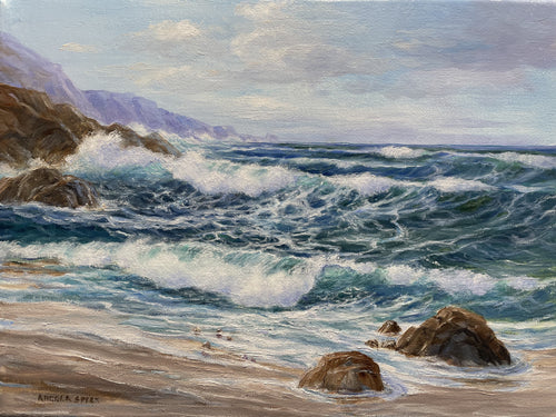 An oceanscape off the Mendocino coast with waves rolling onto a small beach.  There are rocks on the beach and more offshore that the waves hit on their way in.  The sky is blue with white clouds.  The main colors are blue, green, brown, white with a bit of purple.