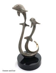 Bronze dolphins swimming in harmony forever and ever, grey crackle patina, black granite base