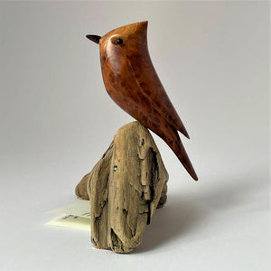 Redwood burl sculpture of titmouse on driftwood stand